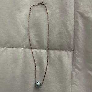 Single blue rolling bead necklace